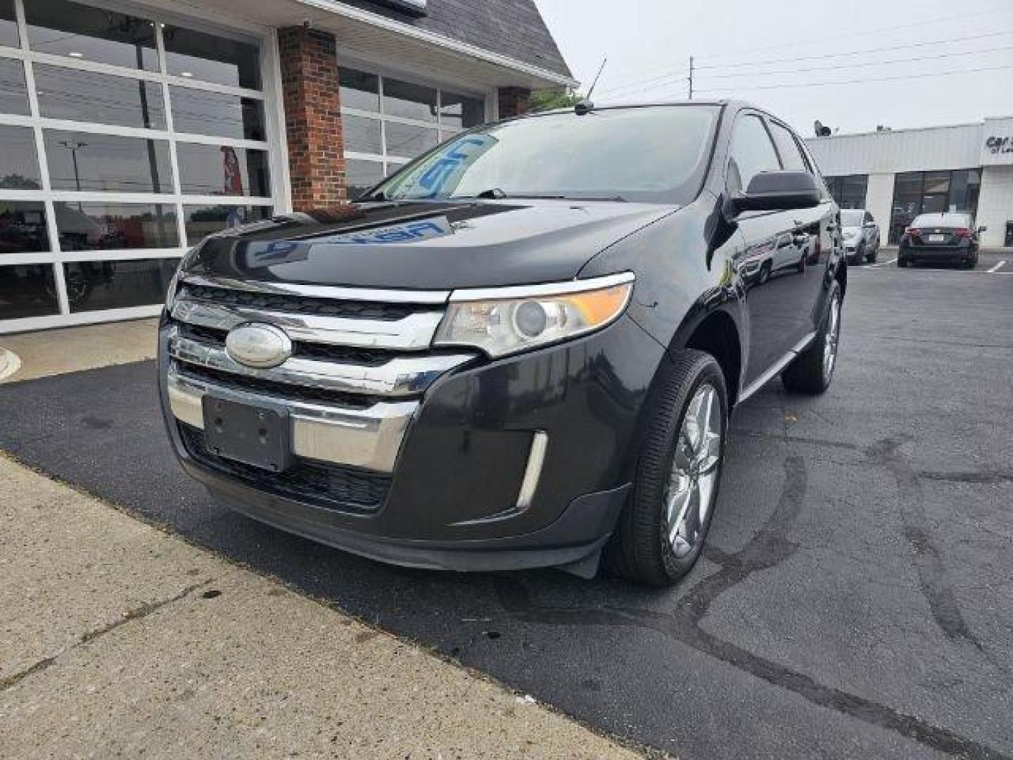 2013 Black /Black Ford Edge (2FMDK3JC6DB) with an 3.5l V6 Smpi Dohc 3.5l engine, Auto transmission, located at 4163 Bardstown Rd, Louisville, KY, 40218, (502) 266-7677, 38.189991, -85.642418 - Deciding on what size of crossover to buy can be tricky. Do you get a large crossover for maximum interior space and roomy third-row seating? Or do you get a small crossover for easier urban maneuverability and higher fuel economy? For some people, the middle ground is the way to go, which is why th - Photo#0
