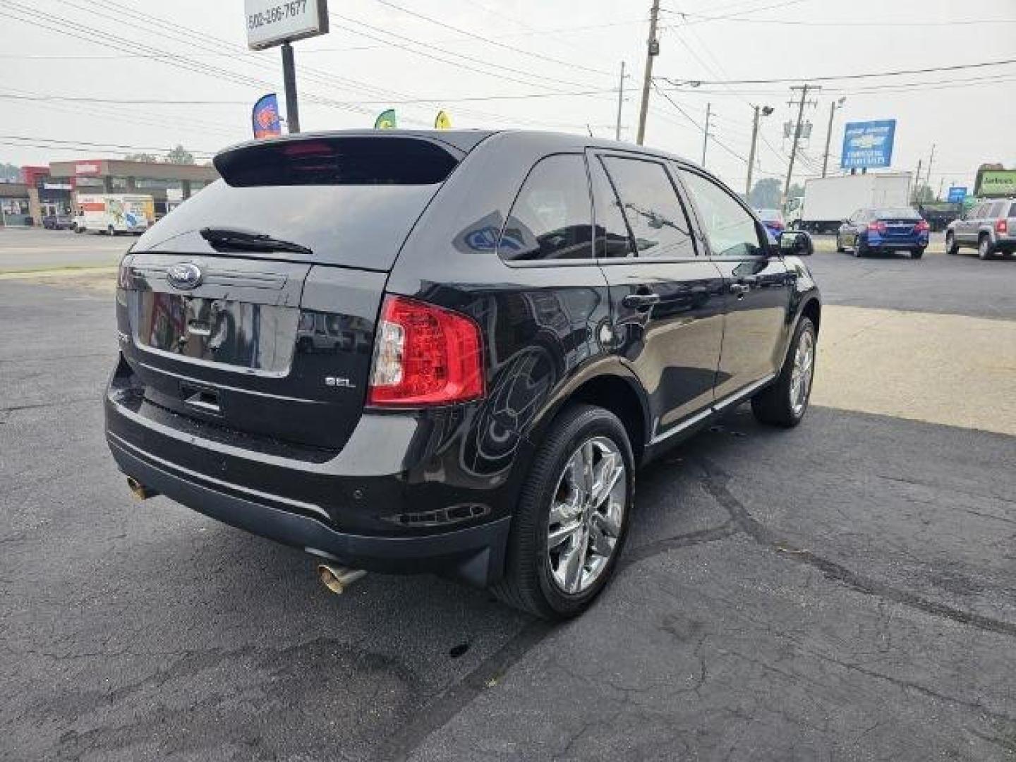 2013 Black /Black Ford Edge (2FMDK3JC6DB) with an 3.5l V6 Smpi Dohc 3.5l engine, Auto transmission, located at 4163 Bardstown Rd, Louisville, KY, 40218, (502) 266-7677, 38.189991, -85.642418 - Deciding on what size of crossover to buy can be tricky. Do you get a large crossover for maximum interior space and roomy third-row seating? Or do you get a small crossover for easier urban maneuverability and higher fuel economy? For some people, the middle ground is the way to go, which is why th - Photo#3