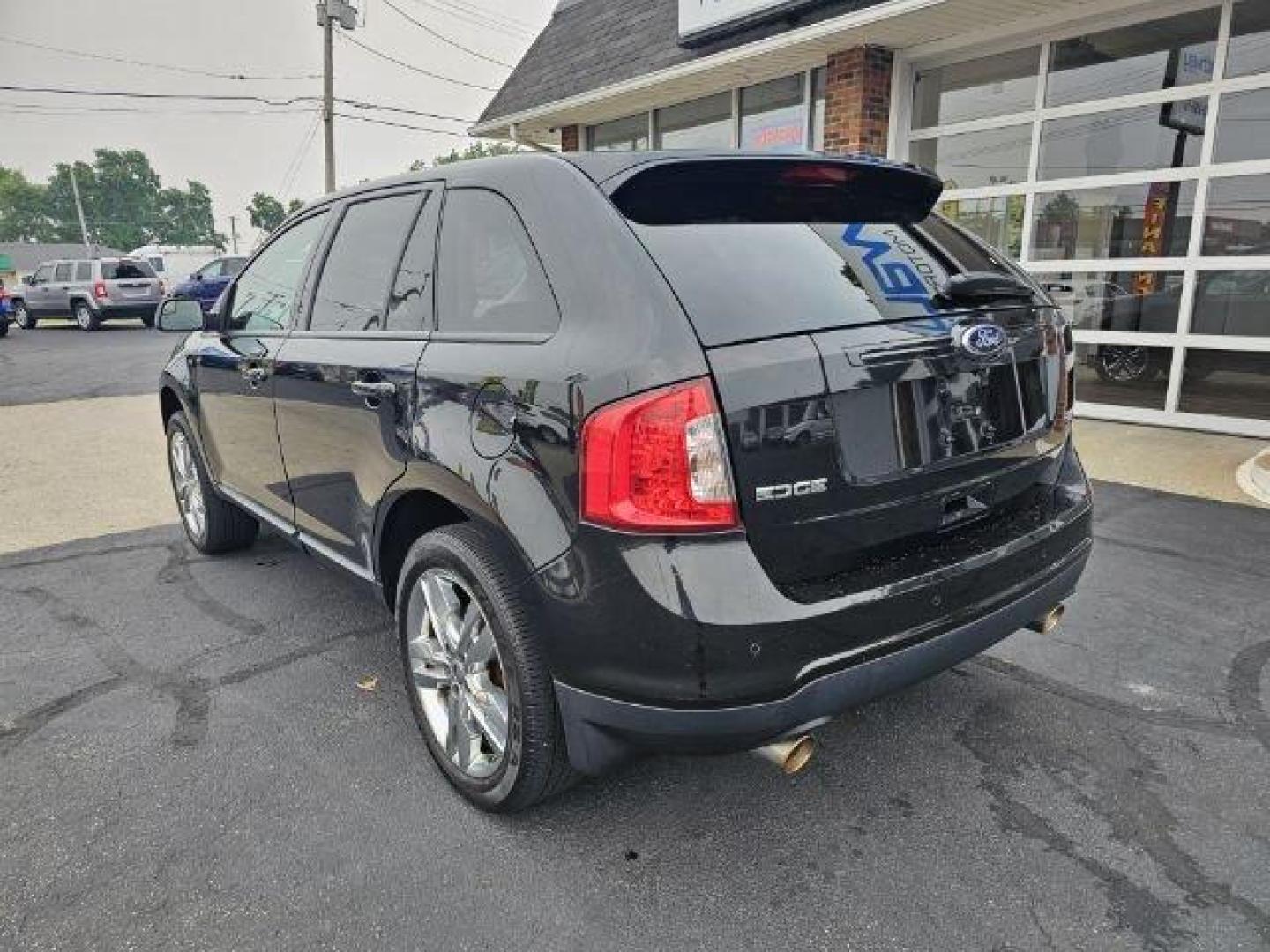 2013 Black /Black Ford Edge (2FMDK3JC6DB) with an 3.5l V6 Smpi Dohc 3.5l engine, Auto transmission, located at 4163 Bardstown Rd, Louisville, KY, 40218, (502) 266-7677, 38.189991, -85.642418 - Deciding on what size of crossover to buy can be tricky. Do you get a large crossover for maximum interior space and roomy third-row seating? Or do you get a small crossover for easier urban maneuverability and higher fuel economy? For some people, the middle ground is the way to go, which is why th - Photo#4